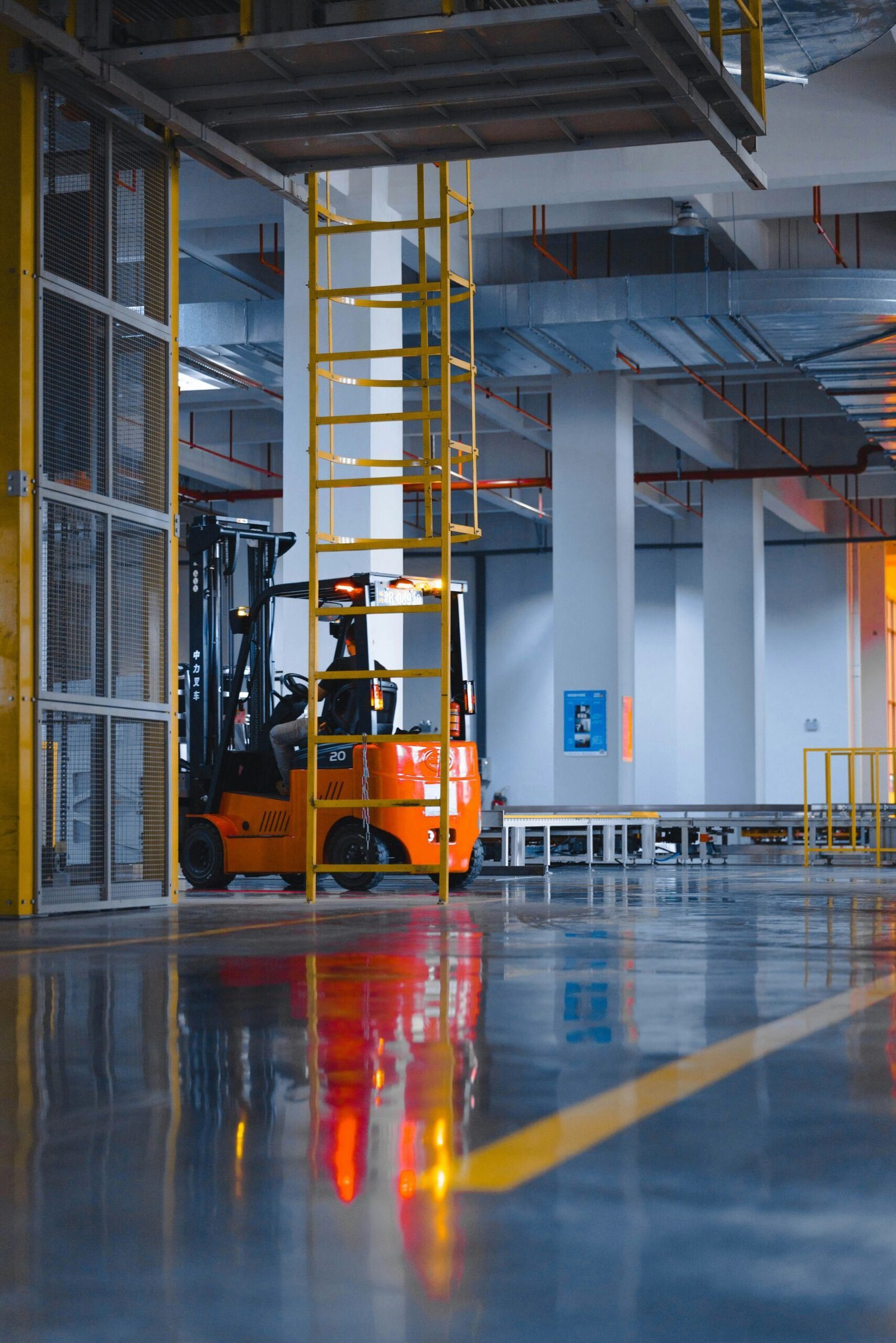 a forklift parked inside of a large warehouse